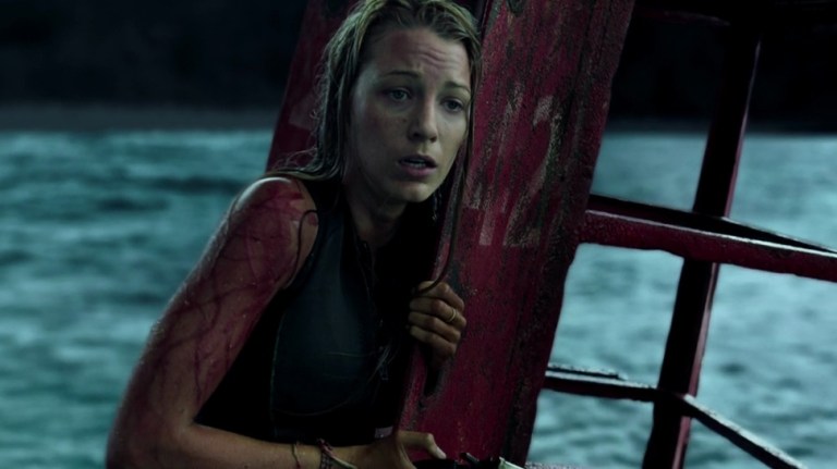 Blake Lively holds onto a buoy in The Shallows (2016).