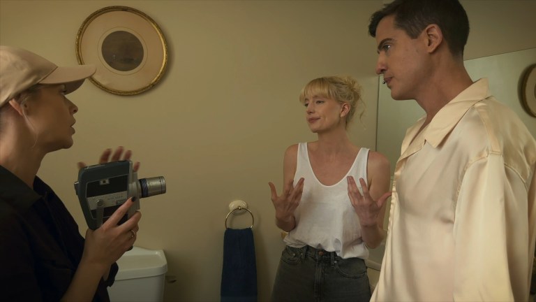 Tori holds a camera as Emma and Matt get serious about their roles in a commercial shoot within the movie Dagr (2024).