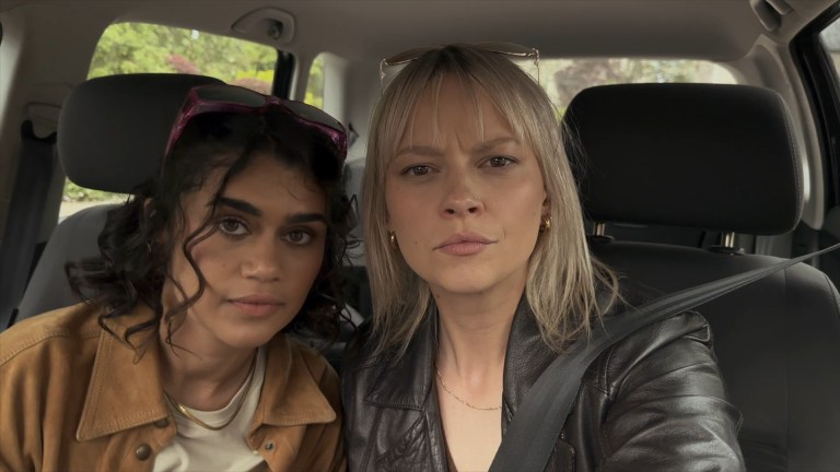 The and Louise pose in their car in Dagr (2024).