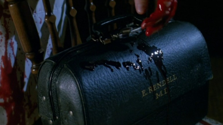 Dr. Giggles drips blood on his doctor's bag in Dr. Giggles (1992).