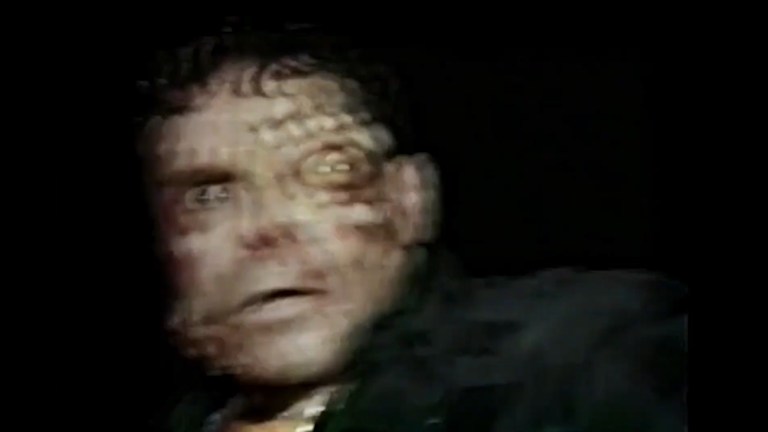 A man's face is affected by his encounter with the Frogman in Frogman (2023).
