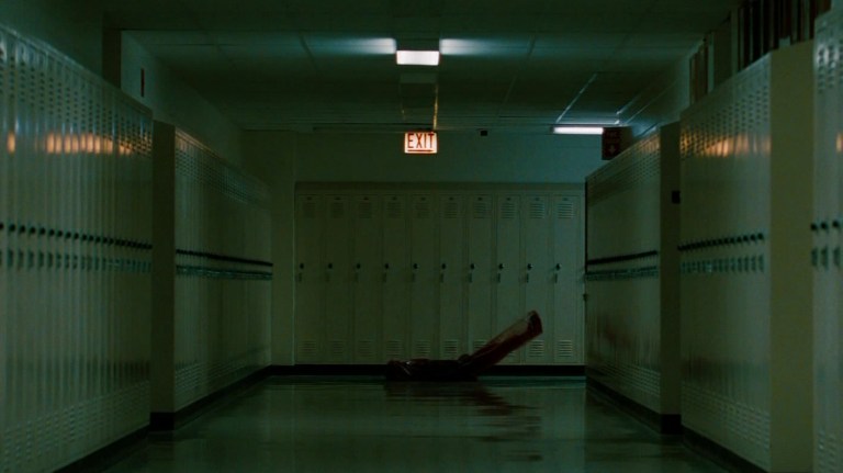 Kris is carried away in a body bag in a school hallway in A Nightmare on Elm Street (2010).
