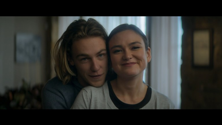 Heath rests his head on Laura's shoulder as they both smile in Snow Valley (2024).