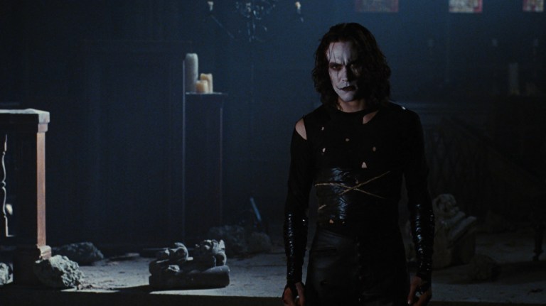 Eric Draven stands inside a church in The Crow (1994).