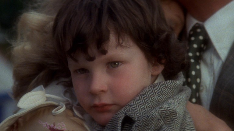 Damien stares blankly in The Omen (1976).