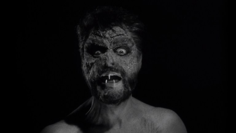A man with fangs and a mutated face in Horrors of Spider Island (1960).