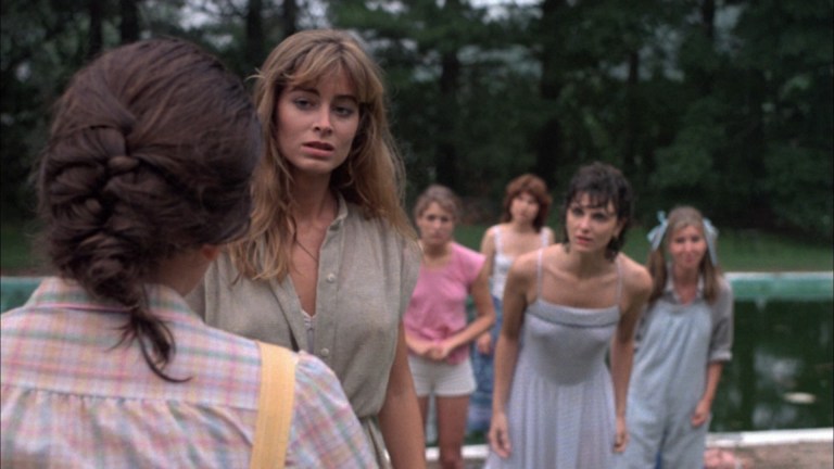 The sisters of the Pi Theta sorority panic after the death of their house mother in The House on Sorority Row (1983).