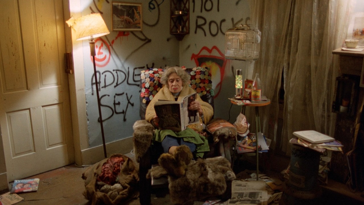 Mother sits in a chair in Mother's Day (1980).