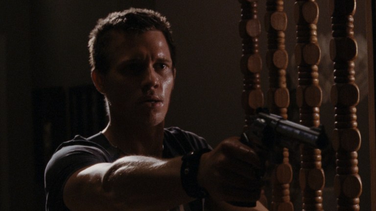 Addley holds a gun in Mother's Day (2010).