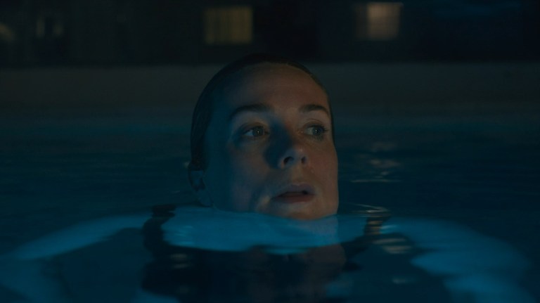 Kerry Condon swims at night in Night Swim (2024).