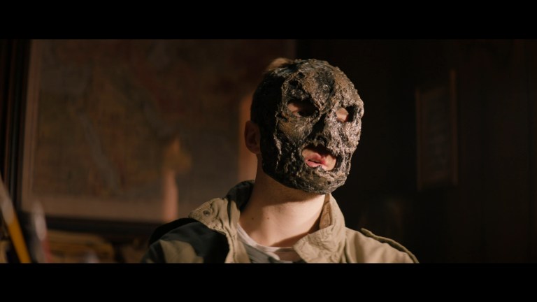 Rick wears his burned mask in Refuge (2023).