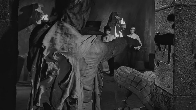 A mummy approaches two women in Wrestling Women vs. The Aztec Mummy (1964).