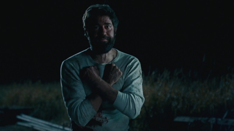 Lee signs "love" in A Quiet Place (2018).