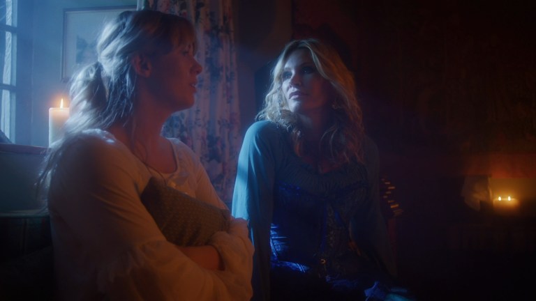 Cinderella and her fairy godmother sit next to each other in Cinderella's Revenge (2024).