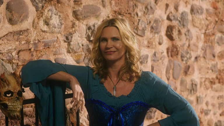 Natasha Henstridge smiles at the camera in Cinderella's Revenge (2024).