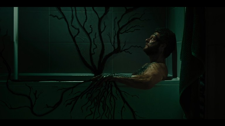 Axel's body infects the bathtub in Kill Your Lover (2023).