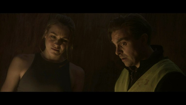Hannaj Bang Bendz and Jacob Anderton as Elena and Michael in Ship of the Damned (2024).