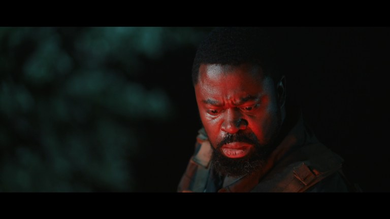 The red light of Hell shines on Leon in The Hangman (2024).