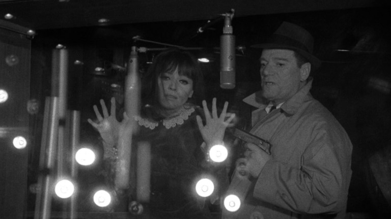 Anna Karina and Eddie Constantine in Alphaville (1965).