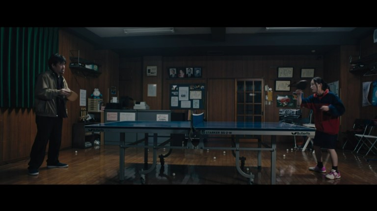 A father and daughter play table tennis in Missing (2021).