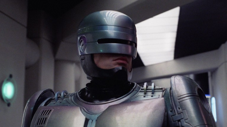 Robocop (Peter Weller) battles ED-209 in Robocop (1987).