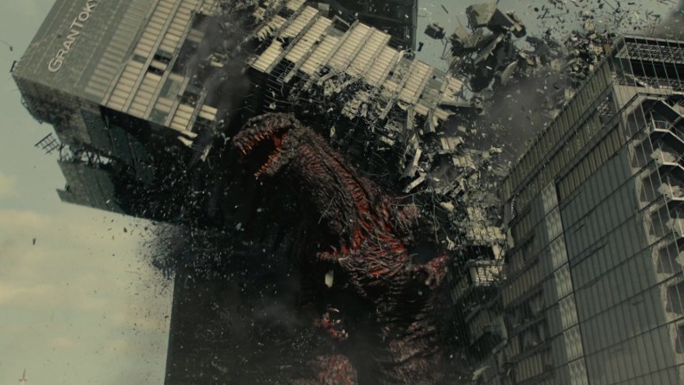 Godzilla destroys a building in Shin Godzilla (2016).