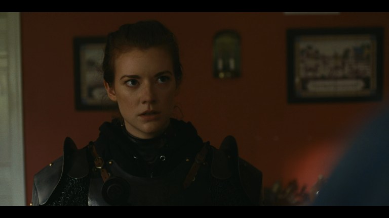 Lily donning her armor in WIld Eyed and Wicked (2023).