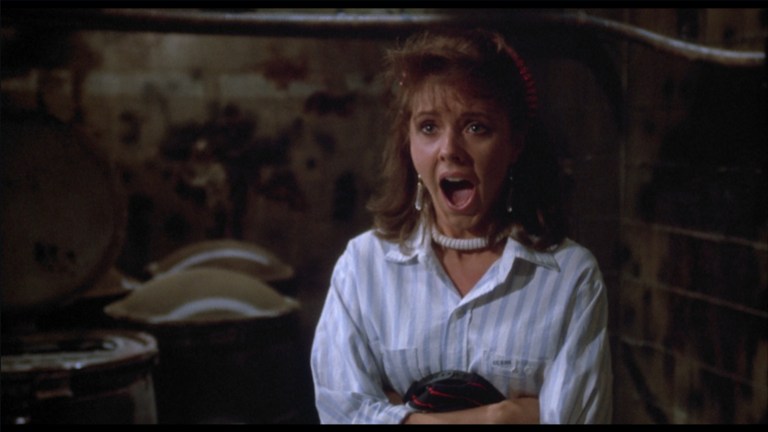 Tina screams in terror in The Return of the Living Dead (1985).