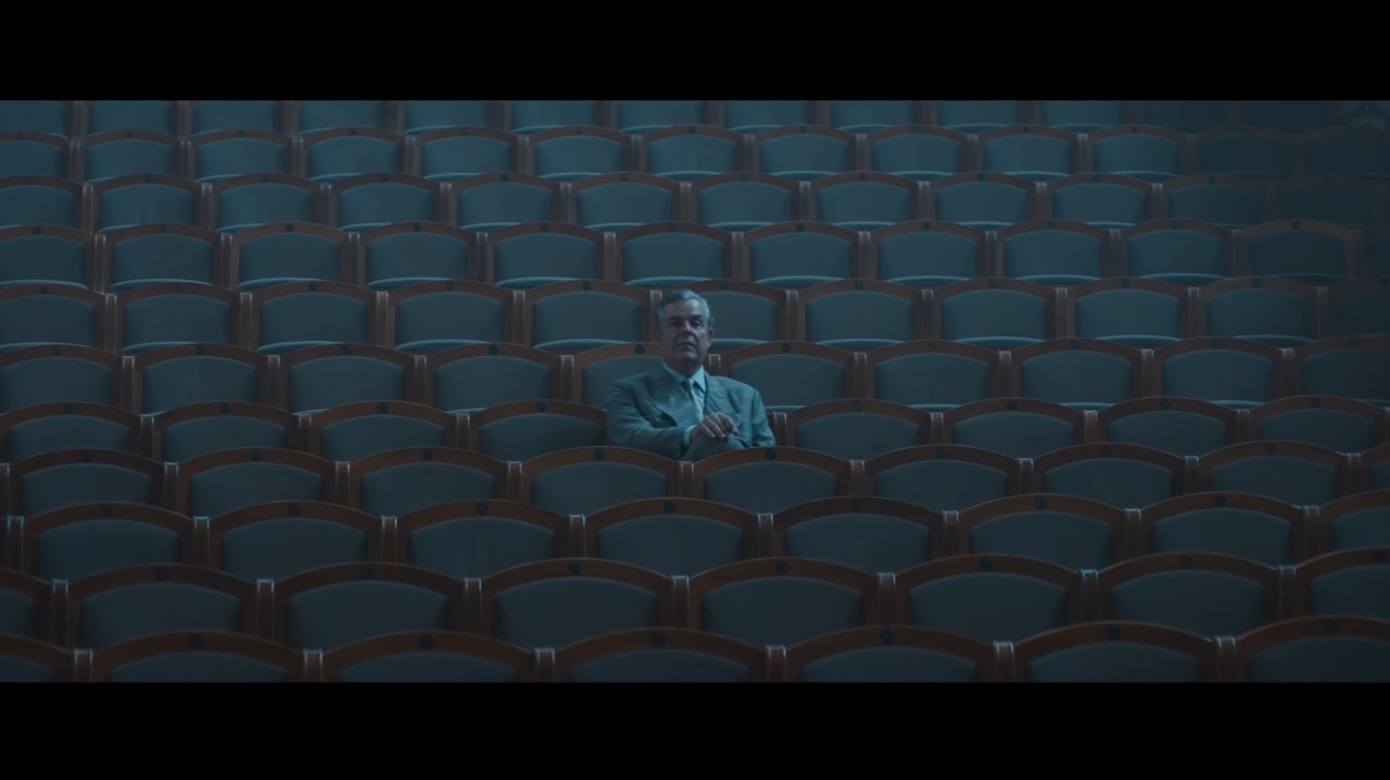 Roeg sits alone in a theater in The Crow (2024).