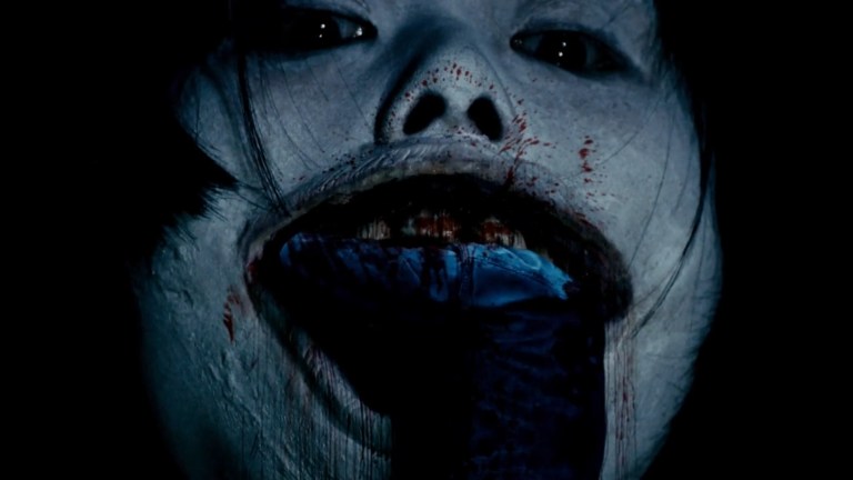 Yoshie bites someone in Death Forest (2014).