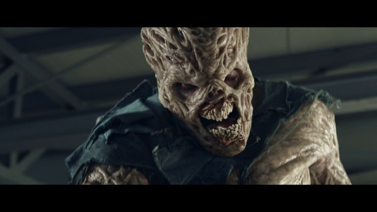 A zombie monster from Zombie Massacre (2013).