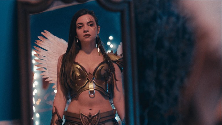 Seeing looks at herself in costume in Terrifier 2 (2022).
