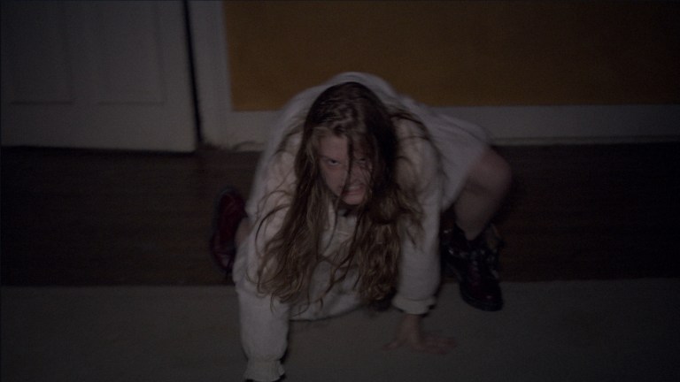 Nell crawls across the floor in The Last Exorcism (2010).