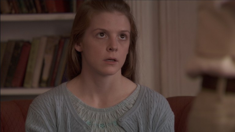 Nell looks up towards Cotton Marcus in The Last Exorcism (2010).