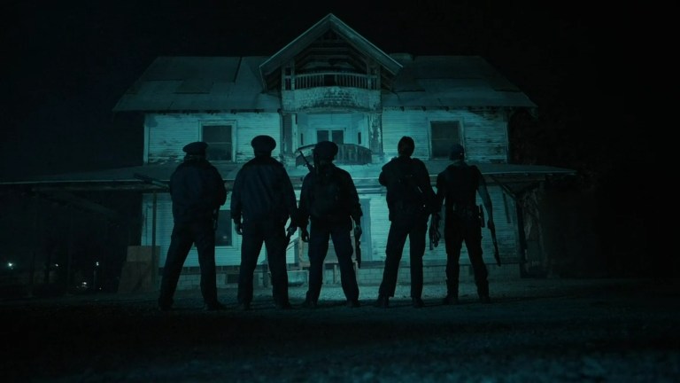 W.A.R.D.E.N. prepares to enter a foreboding house in V/H/S/Beyond (2024).