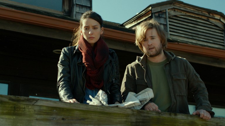 Genesis Rodriguez and Haley Joel Osment in Tusk (2014).