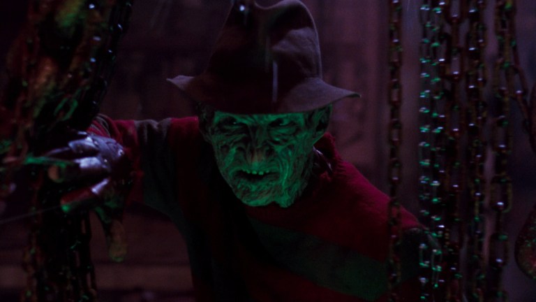 Freddy peeks out from behind some chains in A Nightmare on Elm Street 4: The Dream Master (1988)