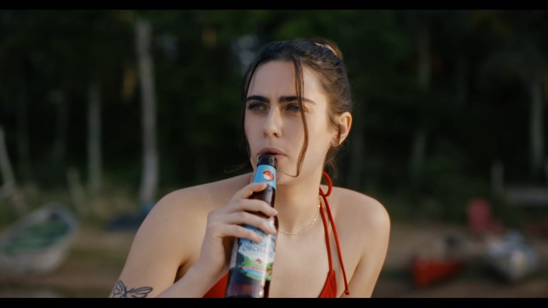 Eve plays with a bottle in Sweet Revenge.