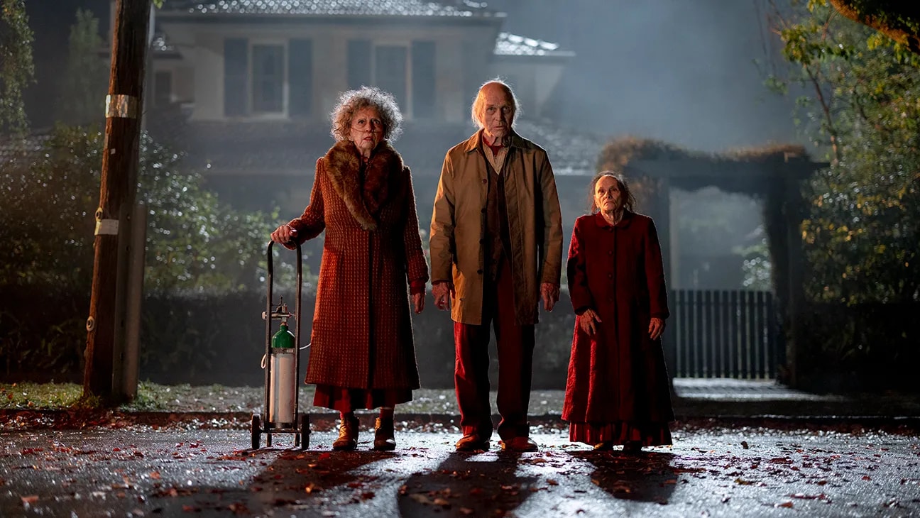 Robed acolytes in a scene from Insidious: Out of the Further