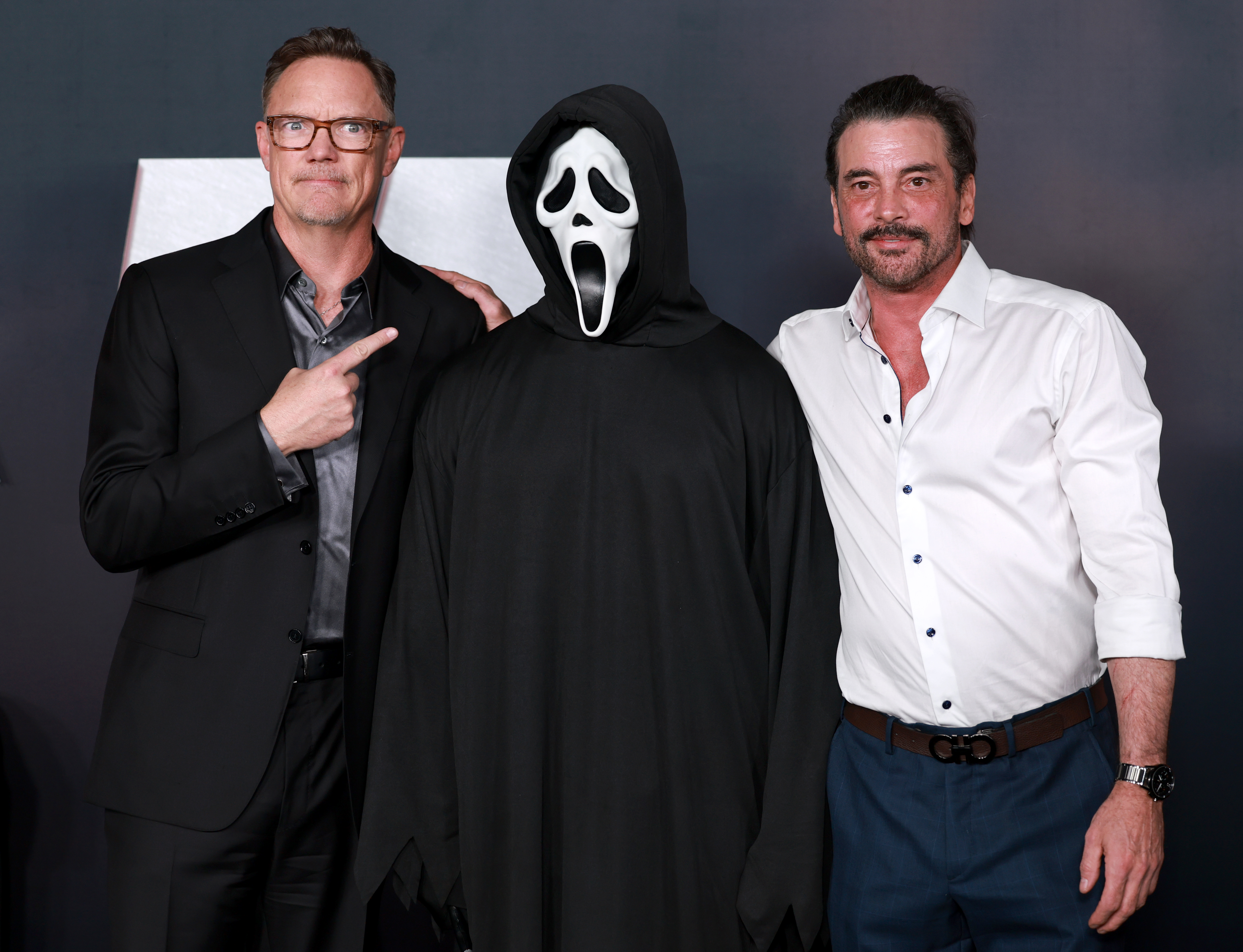 Matthew Lillard, a person in a Ghostface costume, and Skeet Ulrich at the Scream 7 premiere in Hollywood