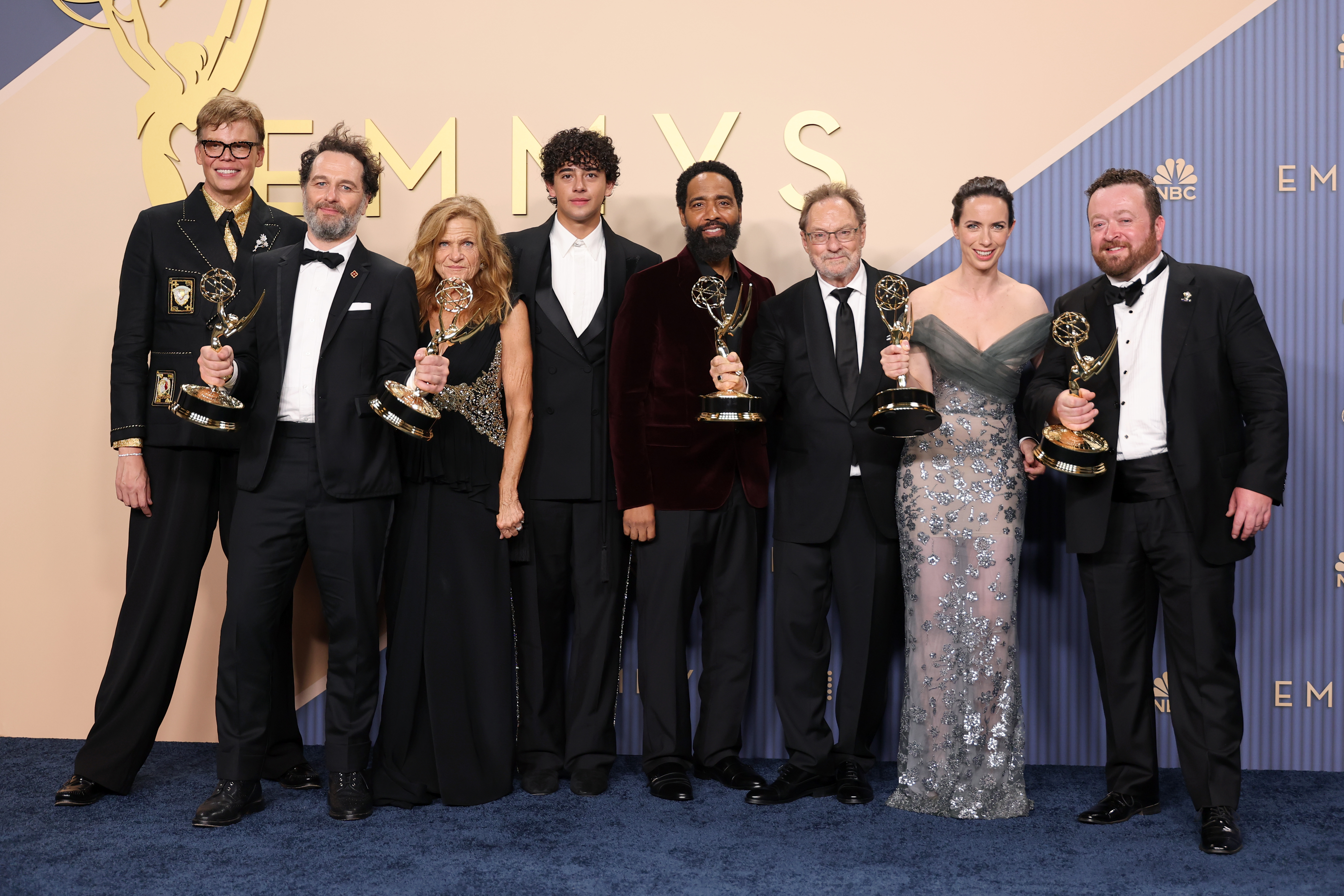 Cast and crew of Widow's Bay posing with the Outstanding Comedy Series Emmy Award in the press room at the 78th Primetime Emmy Awards