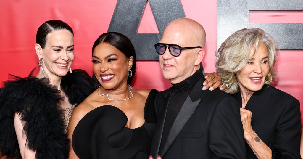 Sarah Paulson, Angela Bassett, Ryan Murphy, and Jessica Lange posing together in black outfits at the American Horror Story: 13 celebration event.