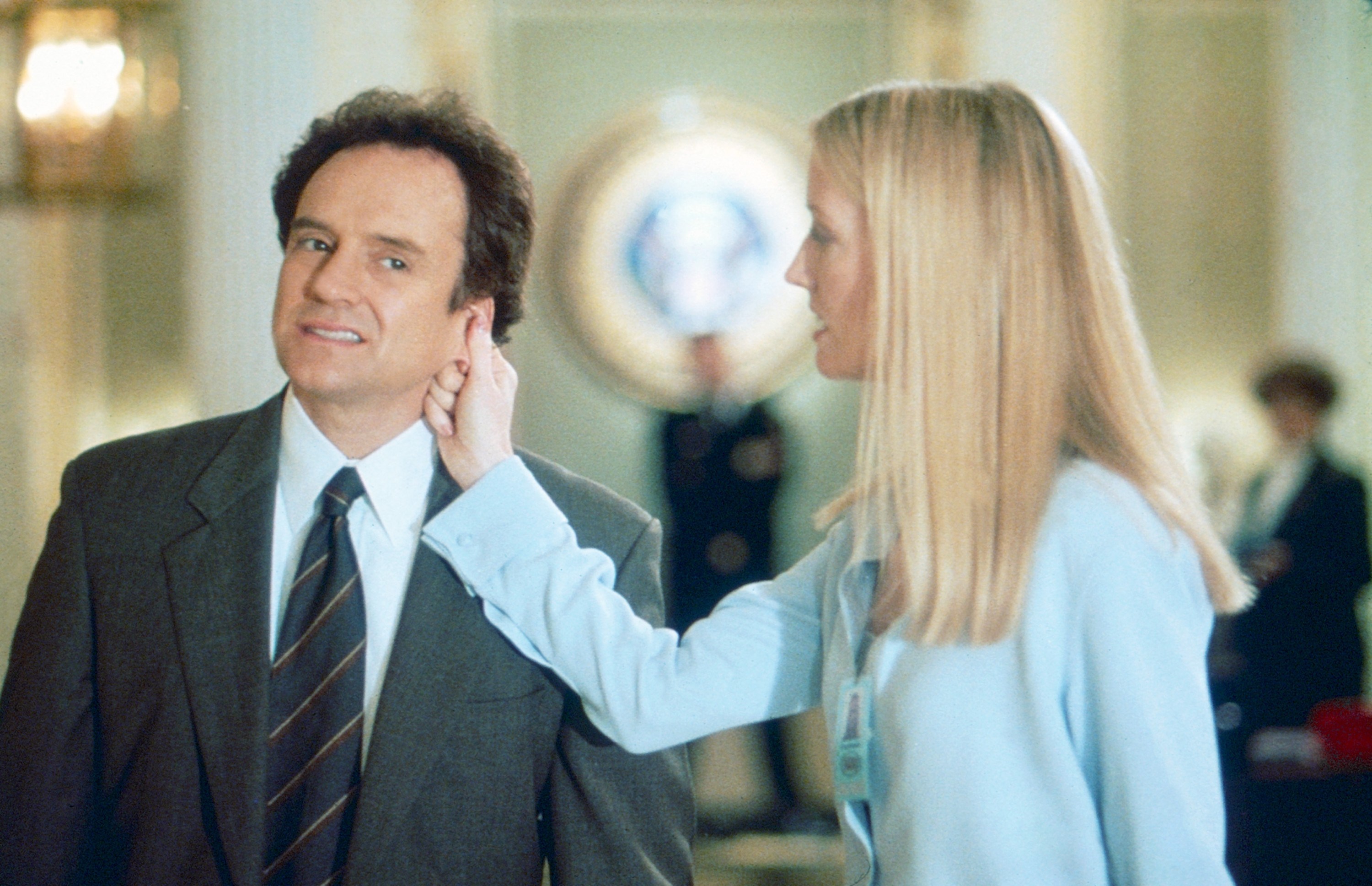 Bradley Whitford and Emily Procter in a scene from The West Wing Season 2