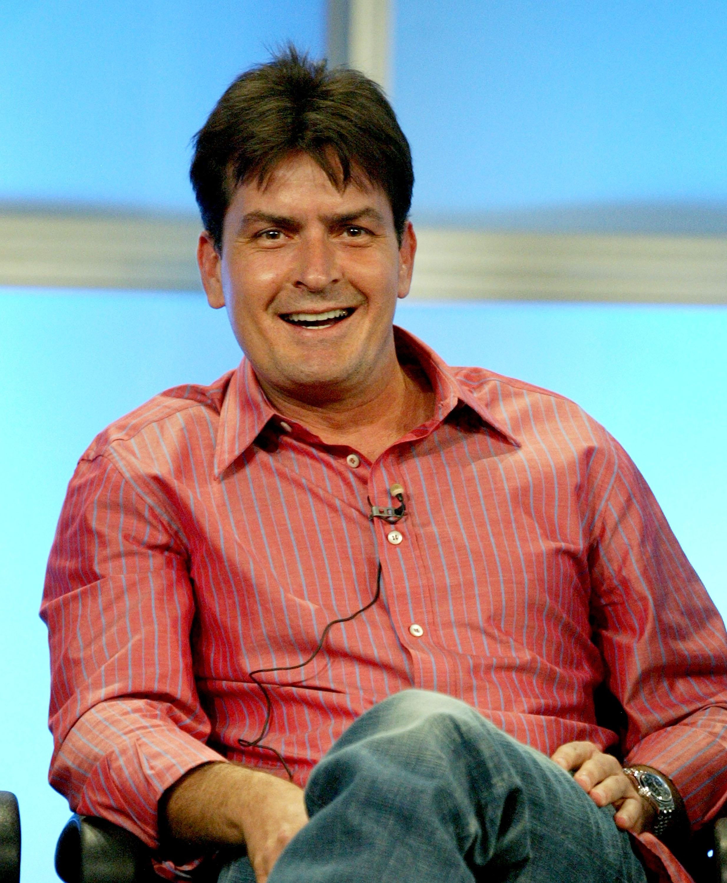 Charlie Sheen seated at a panel discussion at the CBS Television Critics Association Summer Press Tour in Beverly Hills
