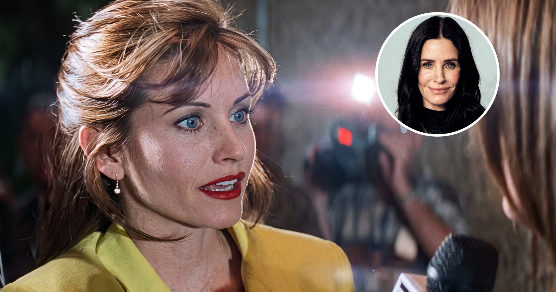 Woman with auburn hair and red lipstick in a yellow blazer being interviewed with a microphone, cameras visible in background.
