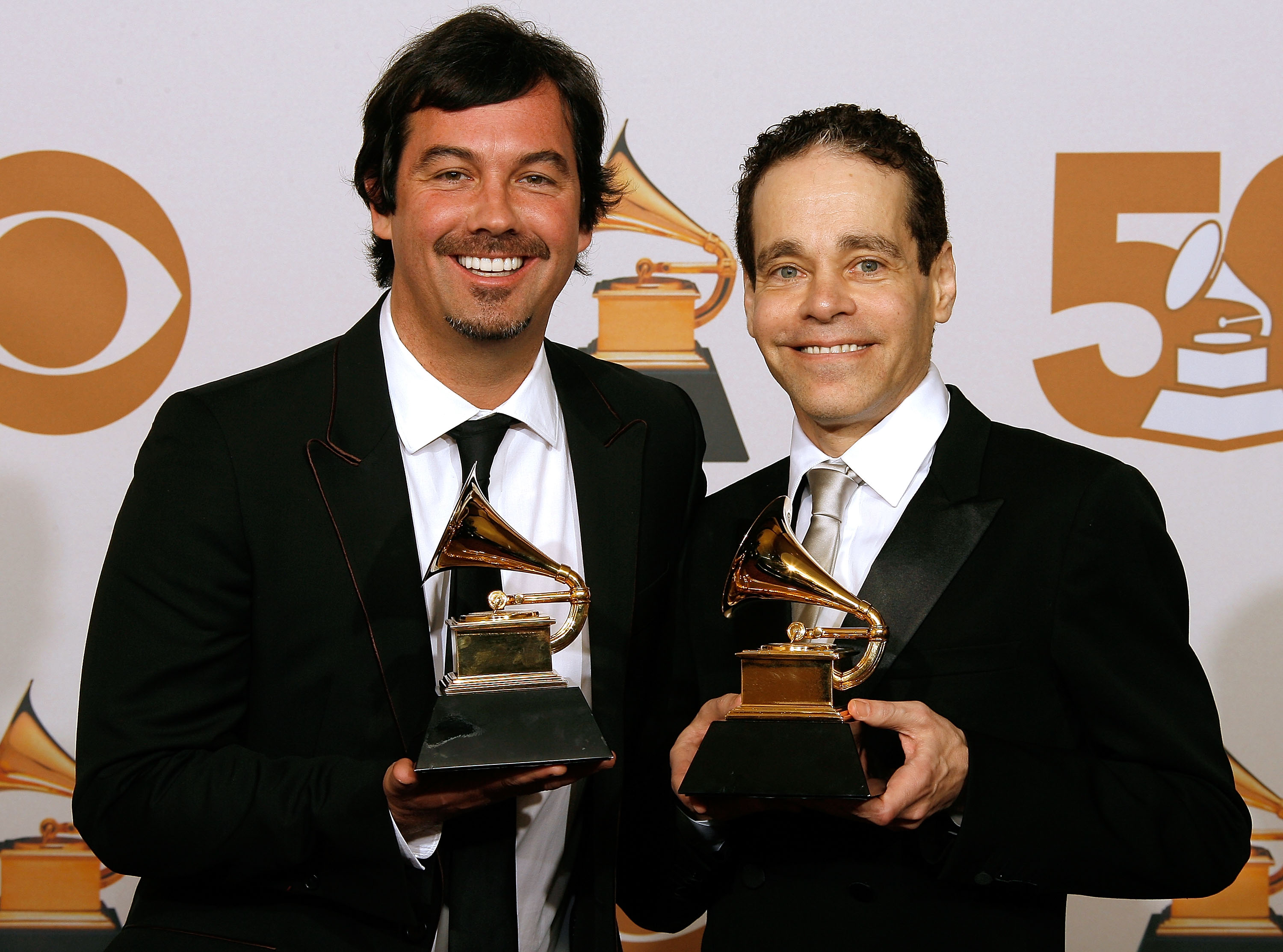 Duncan Sheik and Steven Sater posing with their Grammy Award in the press room at the 50th Annual Grammy Awards