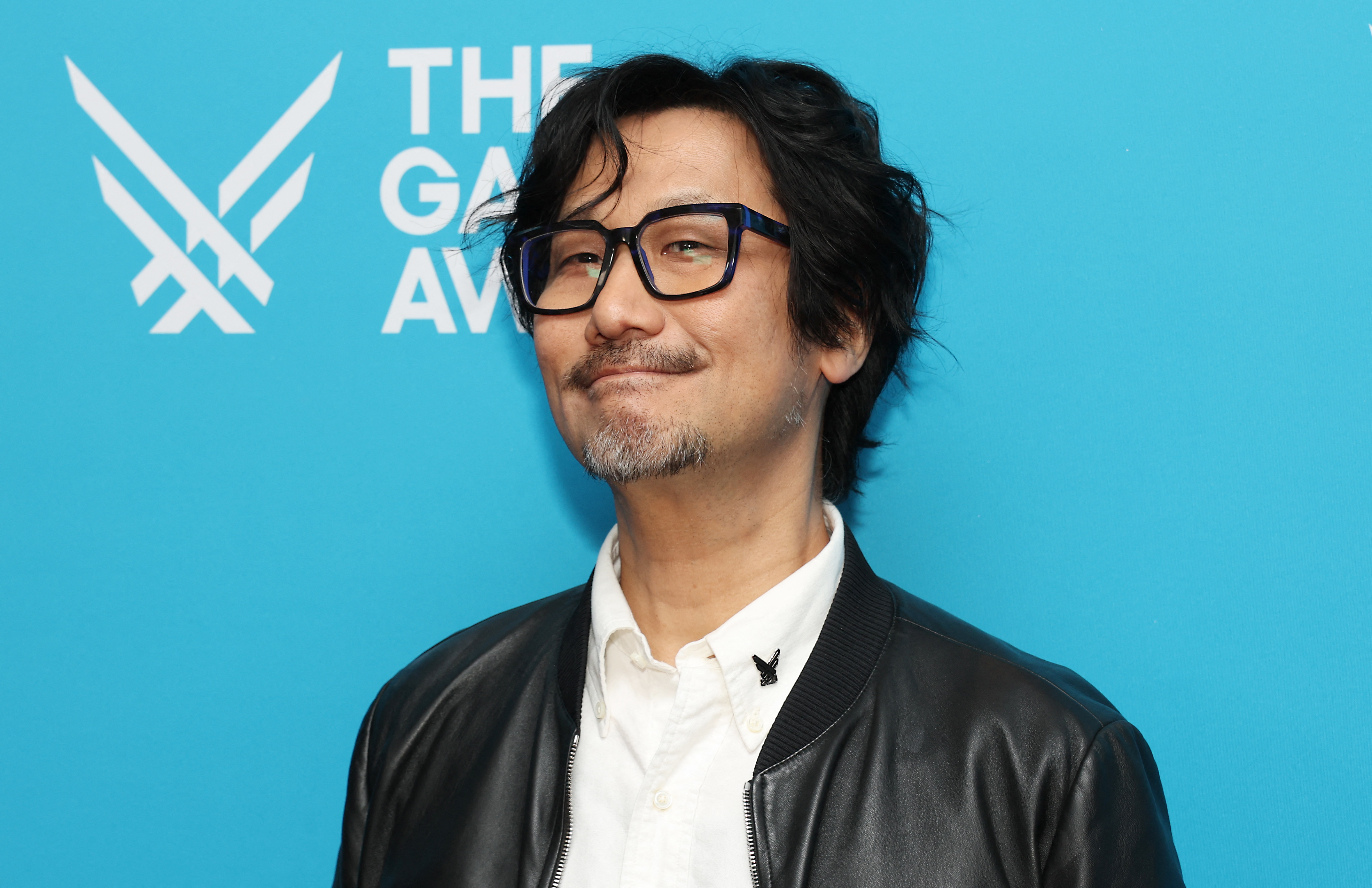 Hideo Kojima posing on the red carpet at The Game Awards at the Peacock Theater in Los Angeles
