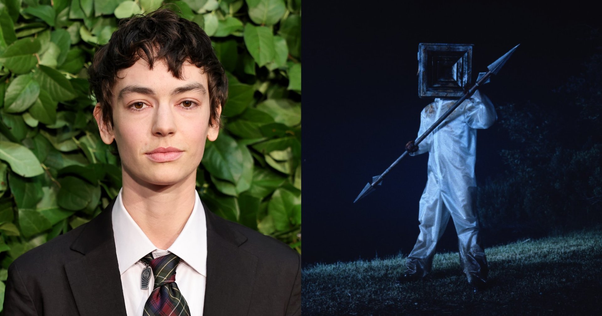 Brigette Lundy-Paine in a dark suit and plaid tie, standing in front of a green leafy wall at the Gothams Film Awards.