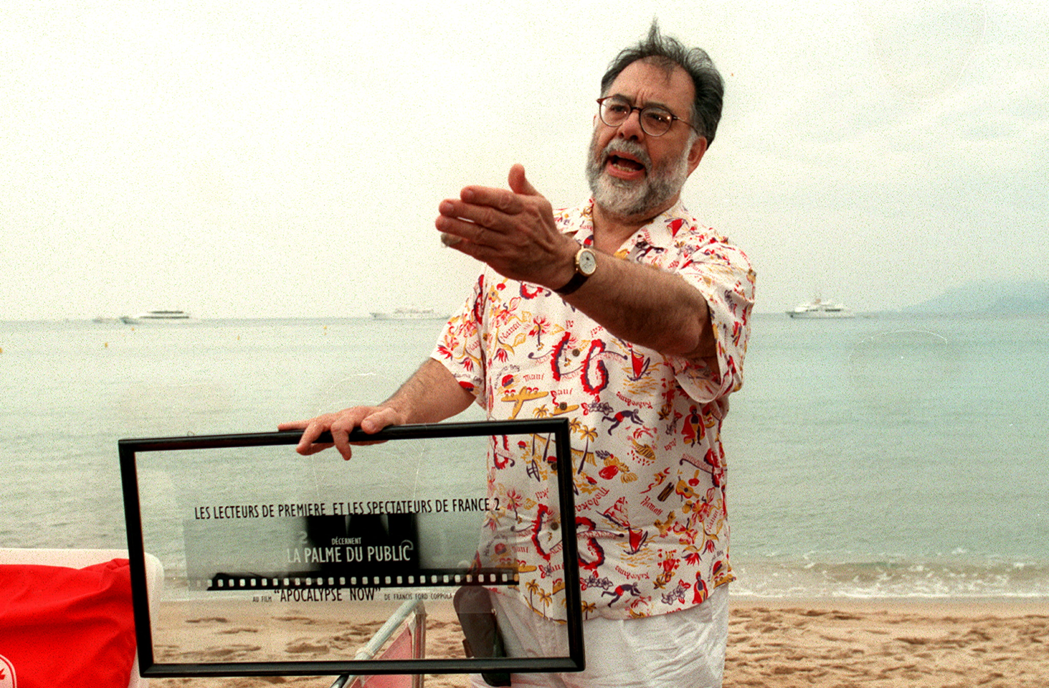 Francis Ford Coppola gesturing at the Cannes Film Festival in 1997 after receiving a public award for Apocalypse Now