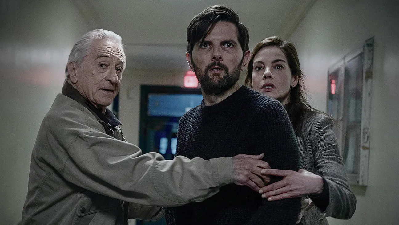 Robert De Niro, Adam Scott, and Michelle Monaghan in a scene from The Whisper Man on Netflix